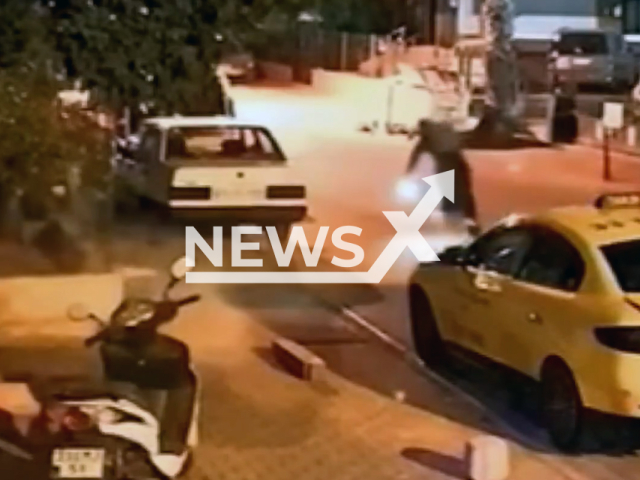This image is a screen grab of the video supplied titled NewsX-BurkSkate-01.mp4: Footage shows suspect  opening fire on a sewing workshop and escaping from the scene on skates in Mersin, Turkey on Sunday, Sep. 28, 2025.(Clipzilla/NX)