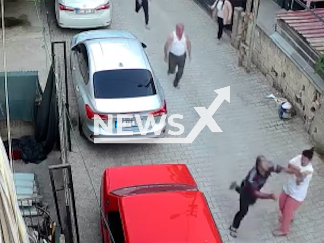 This image is a screen grab of the video supplied titled NewsX-EscapePunch-01.mp4: CCTV footage shows a woman punched while trying to stop a man fleeing the scene after a traffic fight in Adana, Turkey on Monday, Sep. 22, 2025.(Clipzilla/NX)