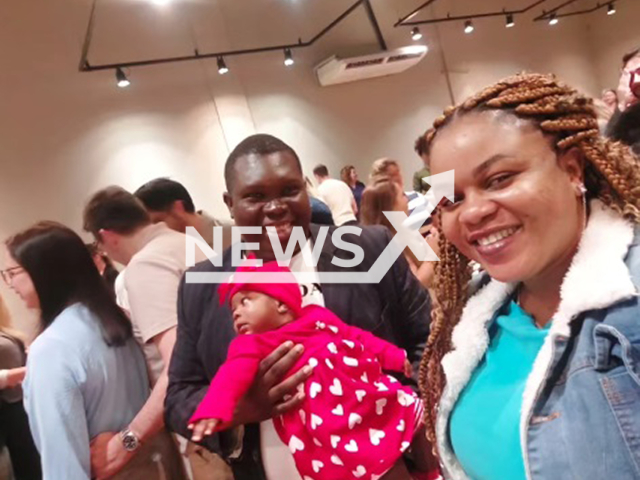 Michelaine Francique poses with Mackendy Bernard, 32, and their daughter in undated photo. She died along with her husband and baby in Palhoca, Brazil. Note: Private photo taken from social media. (Newsflash)