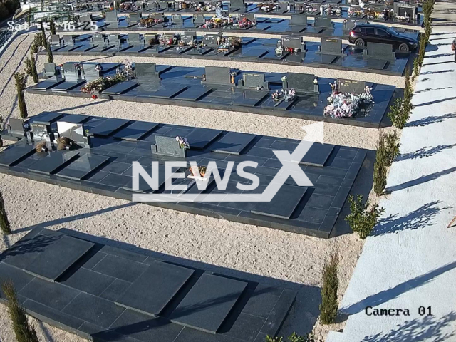 This image is a screen grab of the video supplied titled NewsX-DeadEnd-01.mp4: Footage shows an unknown driver driving a car with German license plates through narrow passages between tombs in Sibenik, Croatia on Saturday, Dec. 13, 2025.(Clipzilla)