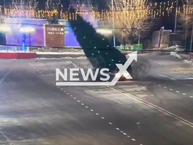 This image is a screen grab of the video supplied titled NewsX-LadaChristmasTree-01.mp4: Footage shows a car spinning in circles around a Christmas tree, slamming into it, knocking it down, and then fleeing the scene the central square in Saryagash, Kazakhstan on Tuesday, Dec. 23, 2025.(Clipzilla)