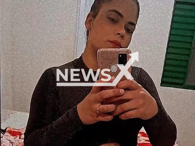 Juliana de Oliveira, 25, poses in undated photo. She died after being attacked by a pitbull in Campinas, Brazil. Note: Private photo. (Newsflash)