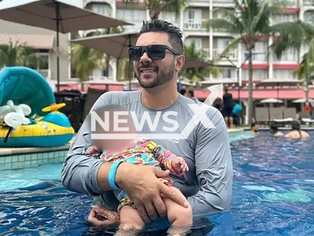 Carlos Cerasomma, 37, poses with daughter in undated photo. He died after choking during watermelon-eating competition in Sao Pedro, SP in Brazil. Note: Private photo. (Newsflash)
