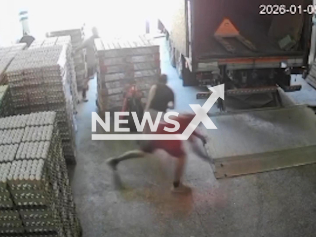 This image is a screen grab of the video supplied titled NewsX-StorCops-01.mp4: Footage shows a retired police officer shooting and killing one suspect and wounded another during a robbery at a warehouse in Villa Soldati, Buenos Aires, Argentina on Monday, Jan. 5, 2026.