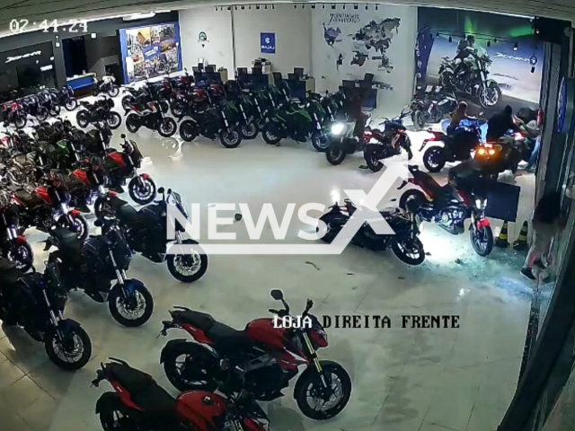 This image is a screen grab of the video supplied titled NewsX-StorBike-01.mp4: Footage shows thieves sealing 12 motorcycles in 3 minutes in car dealership in Itajai, Santa Catarina, Brazil on Tuesday, Jan. 13, 2026.(Clipzilla)