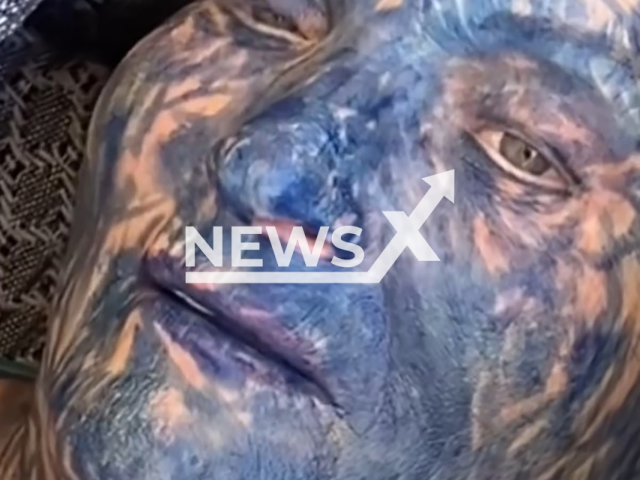 Boy paints grandmother blue while she sleeps in Criciuma, Brazil, undated. Note: Photo is a screenshot from the video (@caroldaros_/Newsflash)
