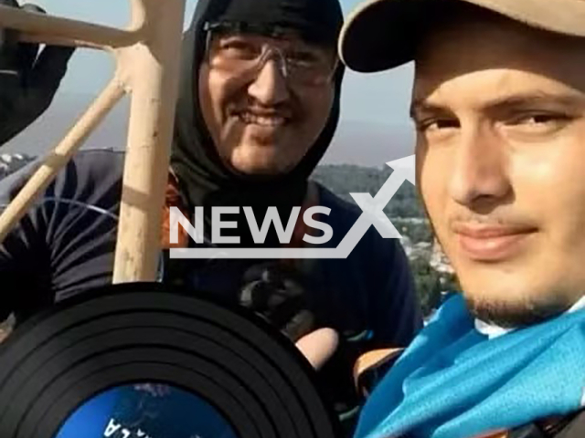 Nando Carvalho, 33, (back) poses with Edirley Teles Pinheiro, 20, (front) in undated photo. They died after transmission tower collapsed in Prainha, Para in Brazil. Note: Private photo. (Newsflash)