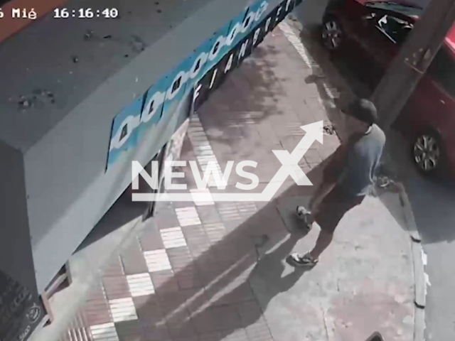 This image is a screen grab of the video supplied titled NewsX-BebyLons-01.mp4: Security footage shows a thief driving off in a car with a three-month-old baby still inside in Mar del Plata, Argentina on Wednesday, Jan. 14, 2026. Police later located the three-month-old baby safe and unharmed 15 blocks away from the crime scene.(Clipzilla)