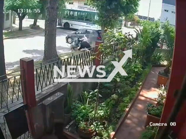 This image is a screen grab of the video supplied titled NewsX-BarrierDrive-01.mp4:  Woman is hit by a car that collided with a bus in San Francisco Solano, Argentina, on Jan.15,2026. The woman was critically injured.