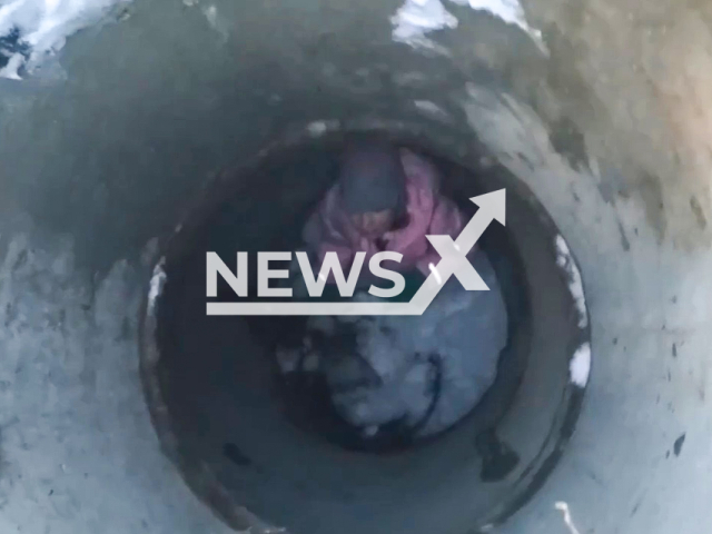 This image is a screen grab of the video supplied titled NewsX-WellGurl-01.mp4: Schoolgirl fall through open manhole in Krasnodar, Russia, on 19 January 2026.(Clipzilla)