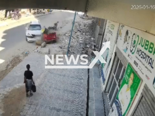 This image is a screen grab of the video supplied titled NewsX-RickShawLoss-01.mp4: Footage shows a car crashing into a group of motorcycles traveling on the road at the Jubba Junction in Mogadishu, Somalia on Friday, Jan. 16, 2026.(Clipzilla)