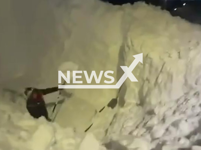 This image is a screen grab of the video supplied titled NewsX-SnowTwice-01.mp4:  Footage shows man digging out his car from a five-meter-deep snowdrift in Kamchatka, Russia on Saturday, Jan. 17, 2026.(Clipzilla)