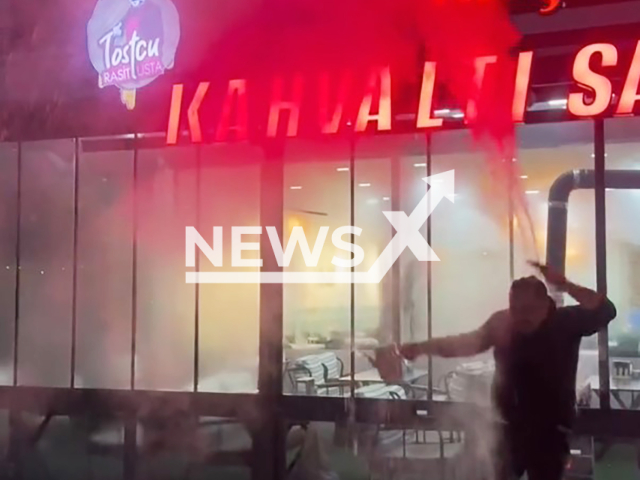 This image is a screen grab of the video supplied titled NewsX-HotBurn-01.mp4: Footage shows Rasit Yildirim attempting to demonstrate freezing temperatures by throwing hot water into the air was burned when the water splashed back onto his hands and back in Sivas, Turkey on Saturday, Jan. 17, 2026.(Clipzilla)