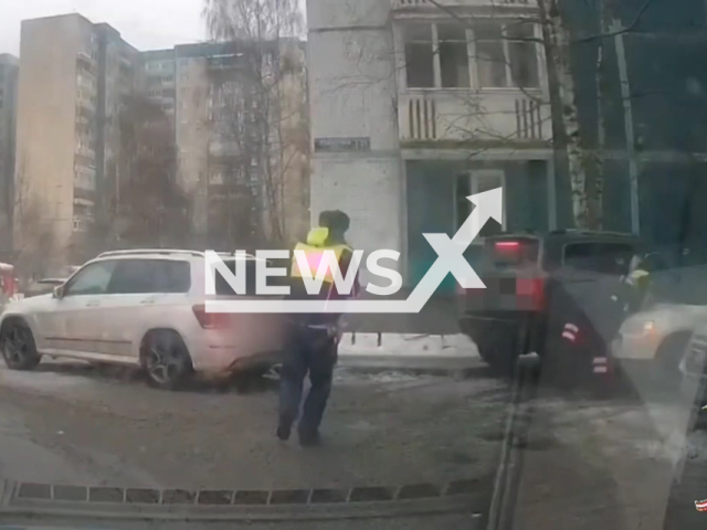 This image is a screen grab of the video supplied titled NewsX-ShootTires-01.mp4: Footage shows a driver being arrested after ramming a police officer, with officers firing at his tires following a chase in Saint Petersburg, Russia on Tuesday, Jan. 20, 2026.(Clipzilla)