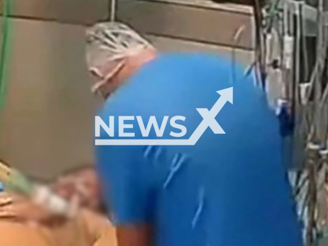 Picture shows nurse suspected of murdering patients in a hospital in  Taguatinga, Brazil at the bedside of a possible victim, undated. Note: Private photo. (Newsflash)