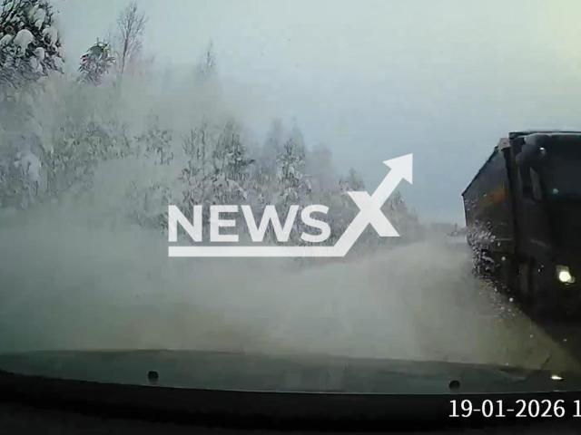 This image is a screen grab of the video supplied titled NewsX-RoadSnow-01.mp4:  Footage shows car ending up in a snowdrift after narrowly escaped heads on coalition with truck in northern Karelia, Russia on Monday, Jan. 19, 2026.(Clipzilla)