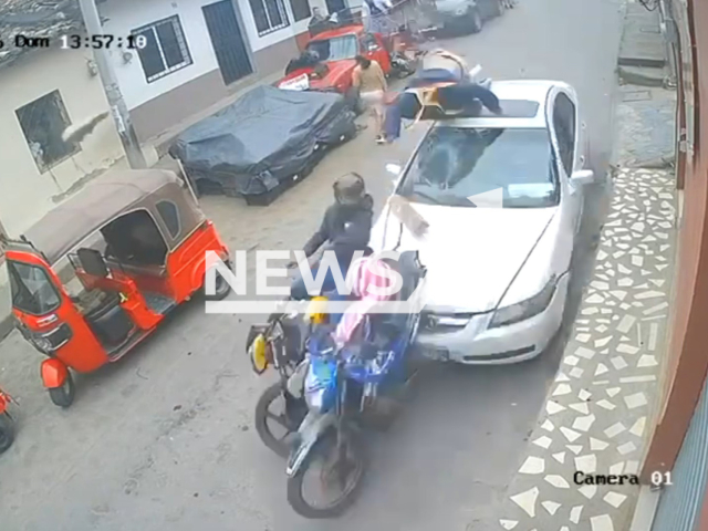 This image is a screen grab of the video supplied titled NewsX-CarBehind-01.mp4: Footage shows out of control vehicle rams two motorcycles from behind in Gracias, Honduras on Sunday, Jan. 18, 2026.(Clipzilla)
