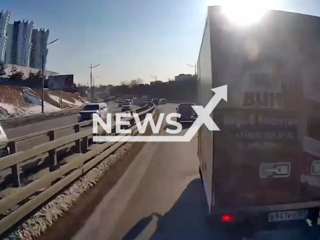 This image is a screen grab of the video supplied titled NewsX-AmbBrake-01.mp4: Footage shows a truck refusing to let an ambulance carrying a seriously ill patient pass in Vladivostok, Primorsky Krai, Russia on Monday, Jan. 19, 2026.(Clipzilla)