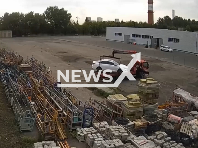 This image is a screen grab of the video supplied titled NewsX-CarHeist-01.mp4: Footage shows suspect driving a tow truck sealing 26 cars from a dealership during a period of six month in Moscow, Russia. According to Russian Ministry of Internal Affairs the suspect was arrested on Thursday, Jan. 22, 2026.(Clipzilla)