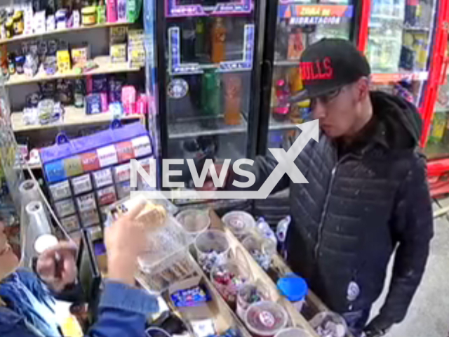 This image is a screen grab of the video supplied titled NewsX-MexGun-01.mp4: CCTV shows a grocery store manager boldly confronting an armed robber, forcing the suspect to flee before later being arrested by police in Pesqueria, Nuevo Leon, Mexico on Sunday, Jan. 25, 2026.(Clipzilla)