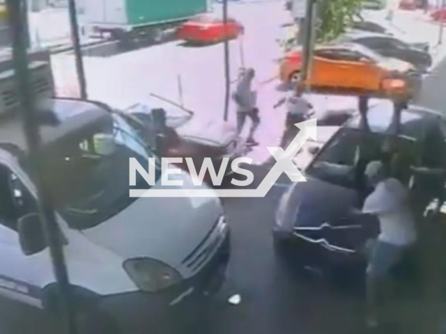 This image is a screen grab of the video supplied titled NewsX-DriveTeys-01.mp4: CCTV shows suspect driving onto the sidewalk and ramming his Citroen into his father and two other people in San Justo, Buenos Aires, Argentina on Wednesday, Jan. 28, 2026(Clipzilla)