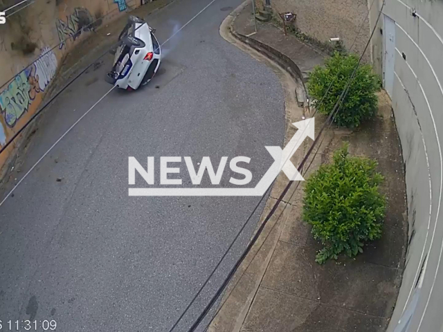 This image is a screen grab of the video supplied titled NewsX-DucRider-01.mp4: Footage shows car falls from overpass in Belo Horizonte, Brazil on Wednesday, Jan. 28, 2026.(Clipzilla)