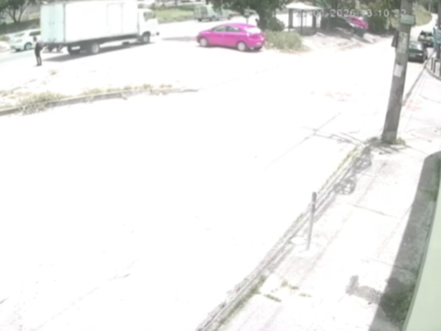This image is a screen grab of the video supplied titled NewsX-TruckLedies-01.mp4: 	
CCTV shows a truck engaging reverse gear to perform an illegal maneuver and hitting the woman, who becomes trapped under the vehicle's wheel in Sao Goncalo, Rio de Janeiro, Brazil on Jan. 27, 2026.(Clipzilla)