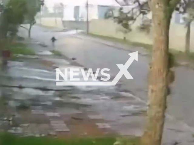 Picture shows a young woman walking against the wind in Sao Jose dos Pinhais, Brazil, Jan. 10, 2026. Note: Photo is a screenshot from the video (Newsflash)
