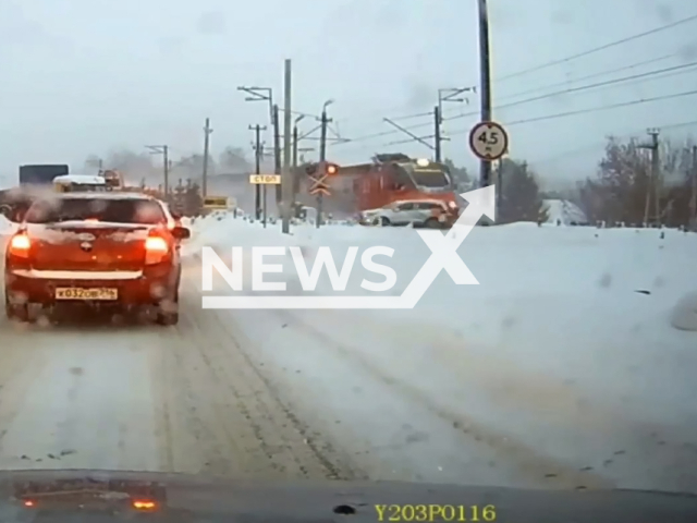 This image is a screen grab of the video supplied titled NewsX-TrainCar-01.mp4: Footage shows passenger train carsharing vehicle on the railway in Kazan, Tatarstan, Russia on Wednesday, Jan. 28, 2026.(Clipzilla)