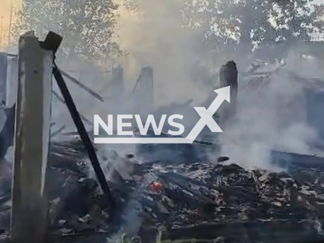 Picture shows the remains of the fire in Kota Bharu, Malaysia, undated. An 89-year-old woman died along with her pets. Note: Private photo. (Newsflash)