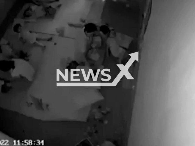 A teacher was filmed suffocating a child who was struggling to sleep with a black plastic bag in a kindergarten in the Yen Bai Province in Vietnam on 14th May 2022.  Note: This picture is a screenshot from the video (Newsflash).