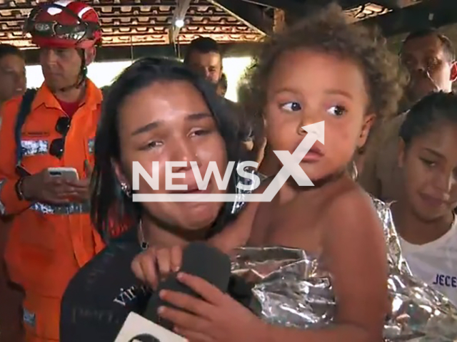Picture shows Alice Maciel Lacerda Lisboa, 4, with mother, Jan. 31, 2026. She was found alive after , dissapearing in the rural area of ​​Lajeado, in the Central Region of Minas Gerais, Brazil. Note: Image is a screenshot from video. (Newsflash)