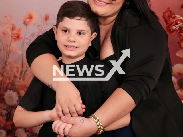 Picture shows Kauan Nycolas Andrade Dantas, 7 , with his pregnant mother, undated. He died in a car accident in Acari, Brazil. Note: Private photo taken from social media. (@hellen_andrade_99/Newsflash)