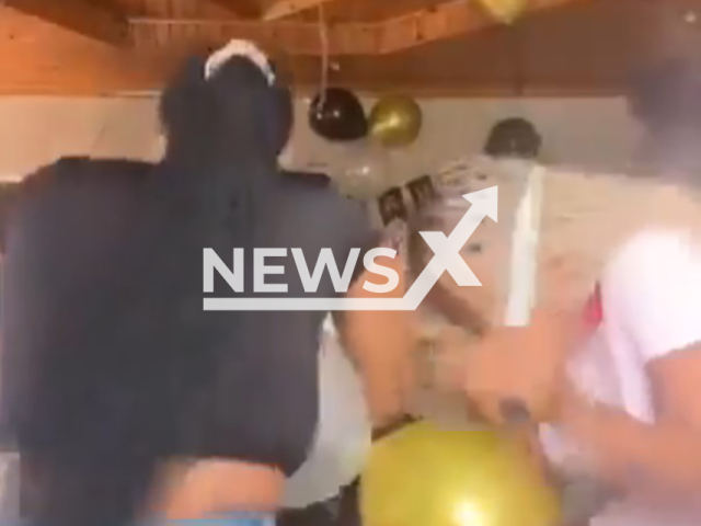Video shows the moment of robbery during a family celebration in Philippi, Cape Town, South Adrica, undated. They stole mobile phones, cash and alcohol. Note: Photo is a screenshot from the video (Newsflash)