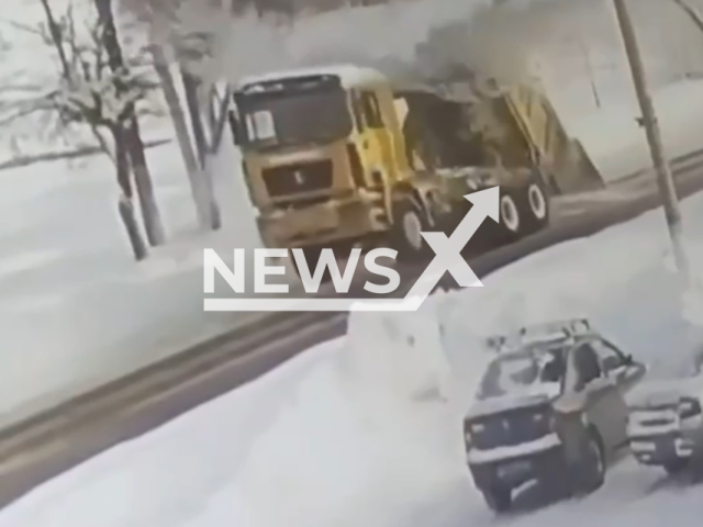 This image is a screen grab of the video supplied titled NewsX-TruckPipes-01.mp4: CCTV shows a dump truck with its raised bed striking and collapsing an overhead heating main sending pipes onto the road and bringing traffic to a standstill near Nizhny Novgorod Airport, Russia on Monday, Feb. 2, 2026.(Clipzilla)