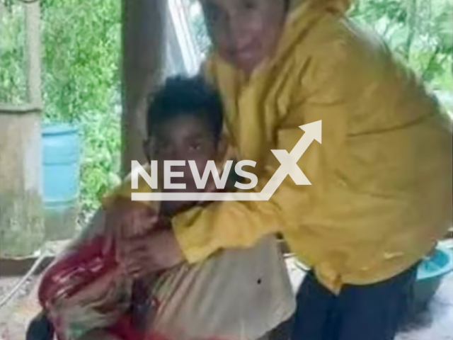 Arturo Hernandez Florez poses with an unnamed woman in undated photo. He was rescued after clinging to a tree for more than 15 hours in Necocli, Colombia. Note: Private photo. (Newsflash)