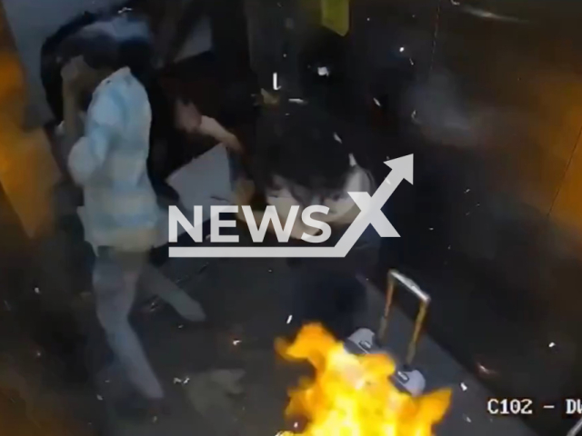 This image is a screen grab of the video supplied titled NewsX-BalloonsExplode-01.mp4: CCTV shows balloons carried into an elevator suddenly igniting and exploding in a burst of flames, briefly obscuring the camera as the occupants flee in panic in Mumbai, India on Monday, Feb. 2, 2026.(Clipzilla)