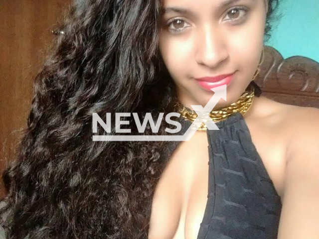 Larissa Maria de Oliveira poses in undated photo. She and her daughter were killed with a machete in Mariana, Brazil. Note: Private photo taken from social media. (Newsflash)