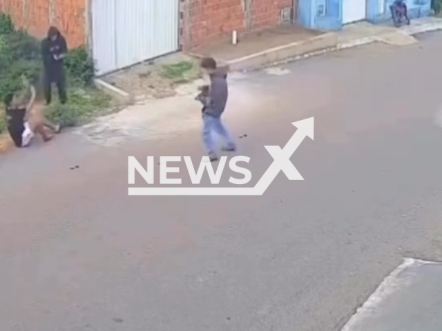 This image is a screen grab of the video supplied titled NewsX-LuckBuk-01.mp4: CCTV shows an attempted murder as two gunmen ambush a 19-year-old arriving home, with their weapons misfiring multiple times before he is seriously wounded in rural Ibiapina, Ceara, Brazil on Wednesday, Feb. 4, 2026.(Clipzilla)