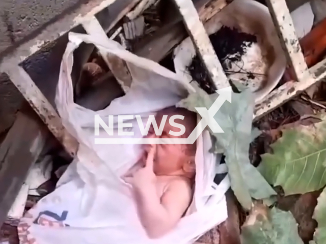 Video shows the baby that was found amidst garbage in Ico, Brazil, undated. It was rescued alive. Note: Photo is a screenshot from a video. (Newsflash)