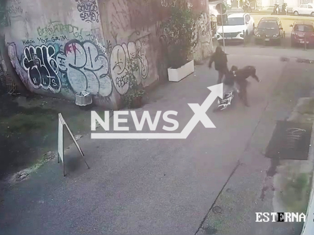 This image is a screen grab of the video supplied titled NewsX-CrazyAccident-01.mp4: Footage shows a man punching a mother on her bike with her son in San Lorenzo, Rome, Italy on Monday, Feb. 2, 2026.(Clipzilla)