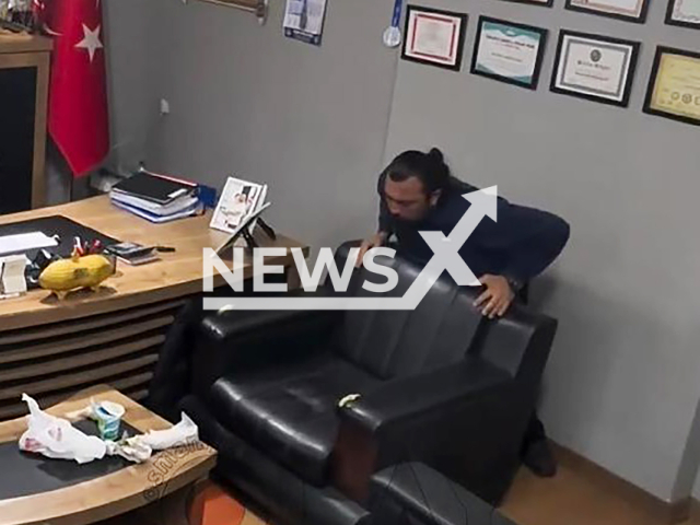 This image is a screen grab of the video supplied titled NewsX-FoodMan-01.mp4: CCTV shows healthcare worker Ilyas Yildir choked on a piece of food and then performing the Heimlich maneuver himself in Osmaniye, Turkey, undated. Footage shared on Tuesday, Feb. 10, 2026.(Clipzilla)