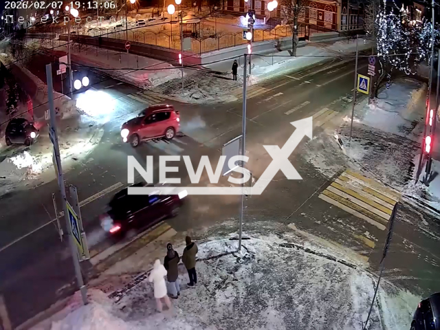 This image is a screen grab of the video supplied titled NewsX-PoleVehi-01.mp4: Footage shows car hitting a pole while dodging another vehicle on the intersection in Kurgan, Kurgan Oblast, Russia on Saturday, Feb. 7, 2026.(Clipzilla)
