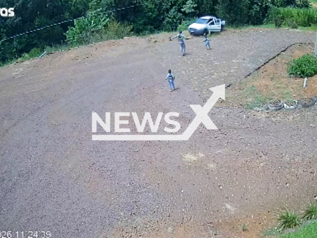 This image is a screen grab of the video supplied titled NewsX-DitRides-01.mp4: Footage shows 6-year-old twins jumping from a moving car after one of them released the handbrake during a game in Francisco Beltrao, Parana, Brazil on Saturday, Jan. 17, 2026.(Clipzilla)