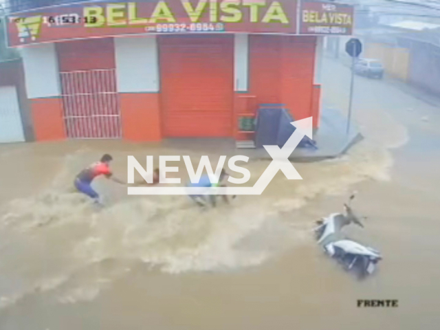 Two women are swept away by floodwaters during heavy rain in Montes Claros, in Minas Gerais, Brazil, on Tuesday, 10 February 2026. Two men who were in front of a grocery store ran to rescue the women. Note: Photo is a screenshot from the video (Newsflash)