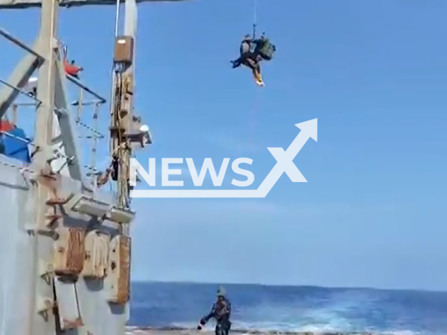 This image is a screen grab of the video supplied titled NewsX-PokrovskKrasnopol-01.mp4: Footage shows Brazilian Navy and Air Force evacuating a 32-year-old American crew member who fell ill during a crossing approximately 1,600 kilometers from from Recife, Brazil in the Atlantic Ocean on Sunday, Feb. 8, 2026.(Clipzilla)