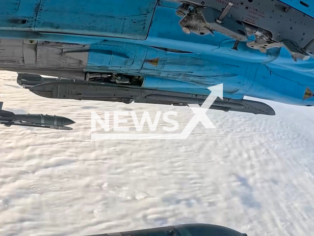 This image is a screen grab of the video supplied titled NewsX-DroneHub-01.mp4: Footage shows Russian Su-34 dropping aerial bombs with a universal planning and correction module on UAV control center in Ukraine on Monday, Feb. 16, 2026.(Clipzilla)