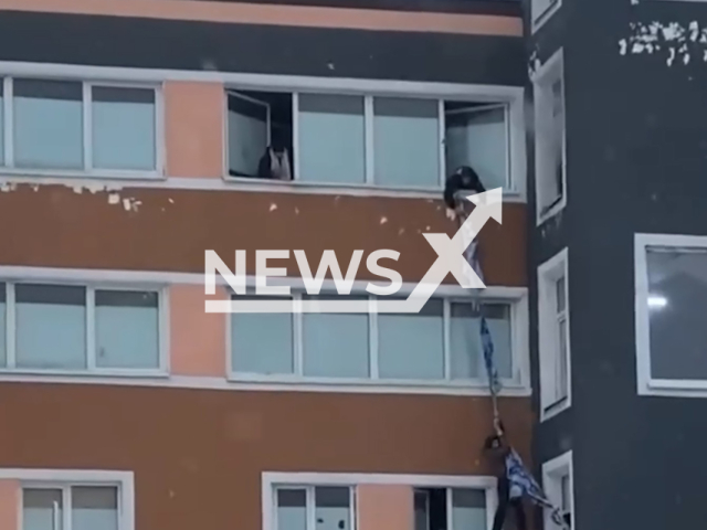 This image is a screen grab of the video supplied titled NewsX-MoscowHostel-01.mp4: Footage shows trapped people jumping out of windows during horrific fire at Moscow hostel, Russia on Monday, Feb. 16, 2026.(Clipzilla)