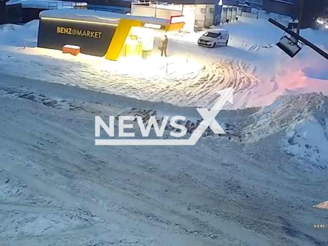 This image is a screen grab of the video supplied titled NewsX-TractorRoad-01.mp4: Footage shows a 13-year-old teenager set fire to gas pumps at a gas station in the Moscow region, Russia on Thursday, Feb. 12, 2026.(Clipzilla)