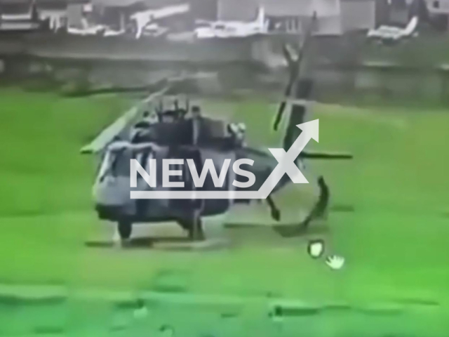This image is a screen grab of the video supplied titled NewsX-LitSoldiers-01.mp4: Footage shows lightning striking near a soldier, damaging a UH-60 Black Hawk helicopter and injuring the soldier in Popayan, Cauca, Colombia on Sunday, Feb. 15, 2026.(Clipzilla)